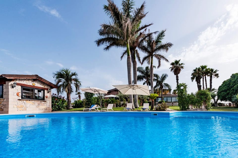Property building, Day, Pool view, Swimming pool, sunbed