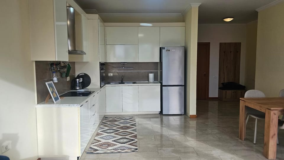 Kitchen or kitchenette, dishwasher, oven, stove