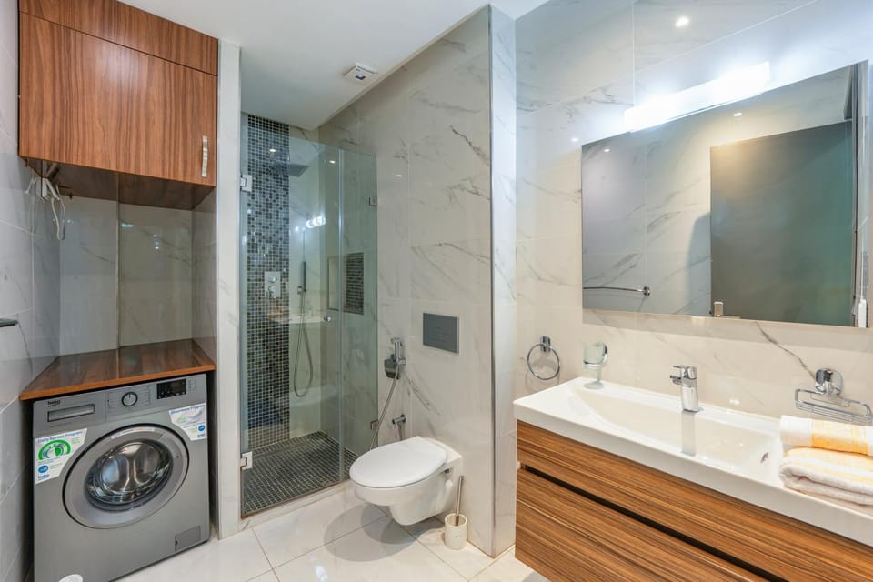 Shower, Toilet, Bathroom, towels, washing machine, dryer