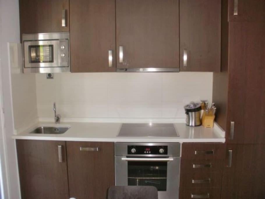 Kitchen or kitchenette, oven, stove