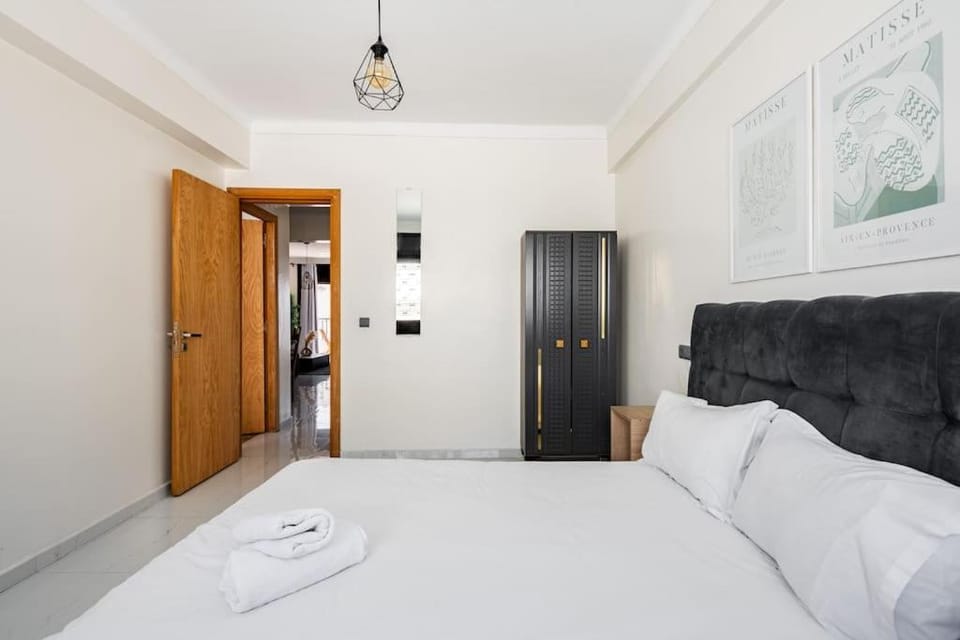 Bed, towels, wardrobe