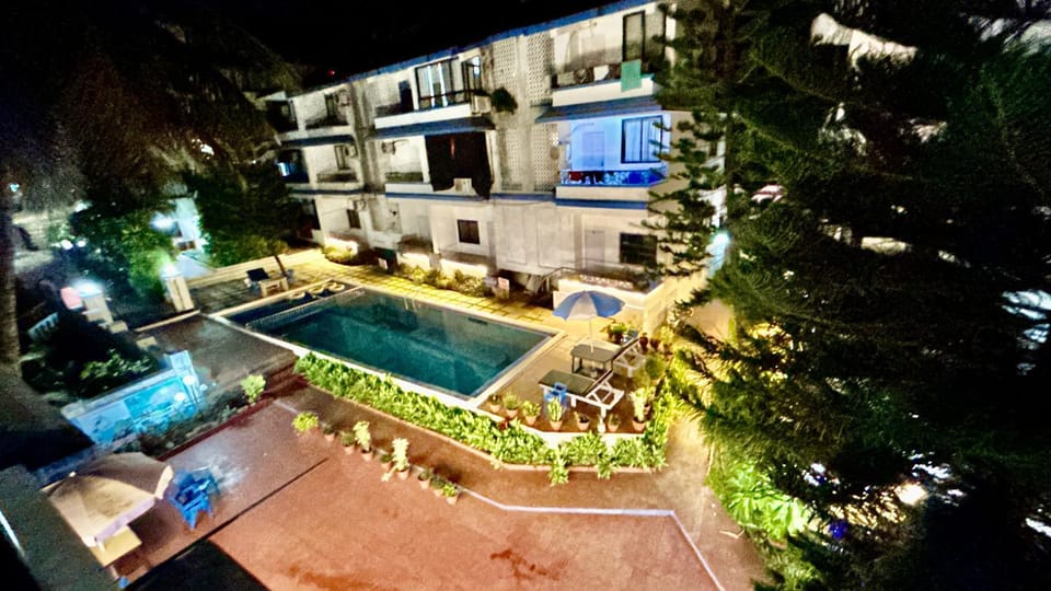 Property building, Patio, Night, Garden, Garden view, Pool view, Swimming pool