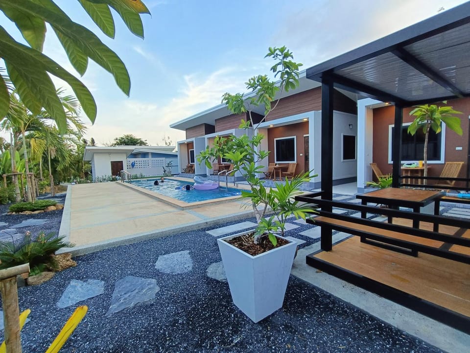 Property building, Patio, Day, Garden, Garden view, Pool view, Swimming pool, sunbed