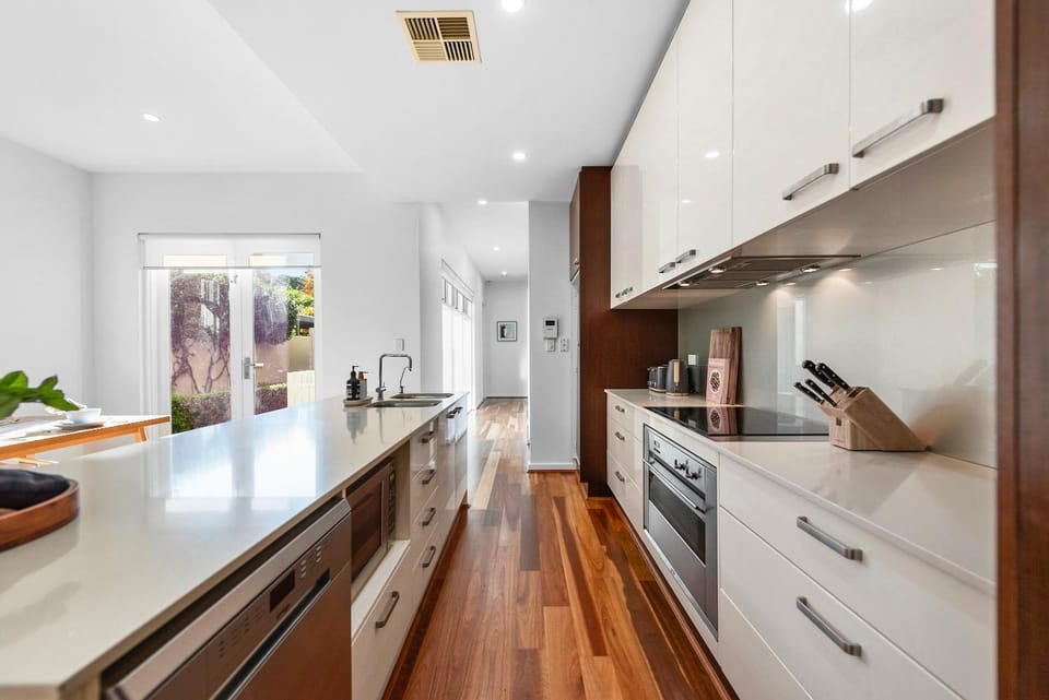 Kitchen or kitchenette, dishwasher, oven, stove