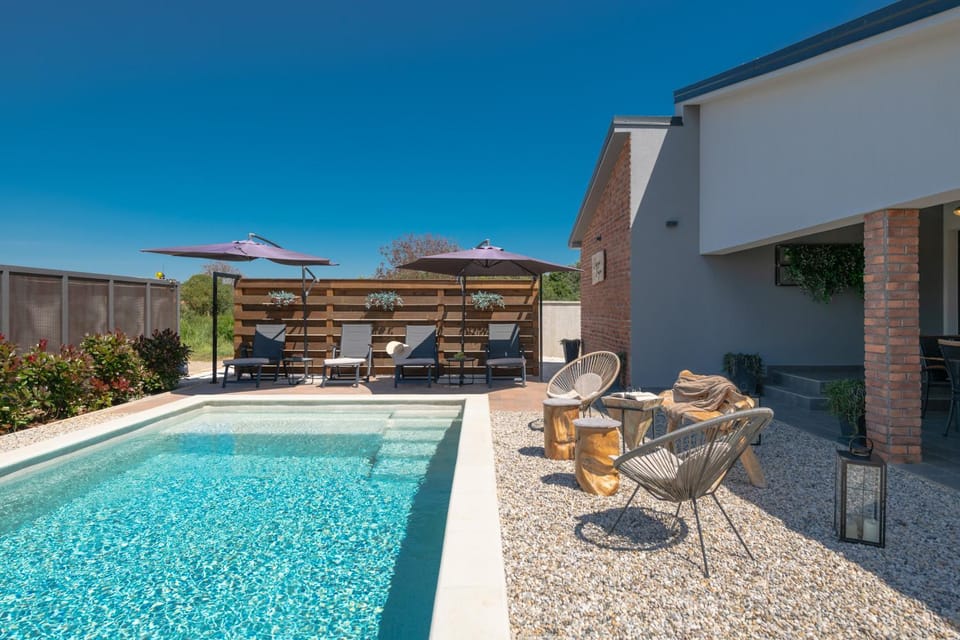 Property building, Patio, Pool view, Swimming pool, sunbed
