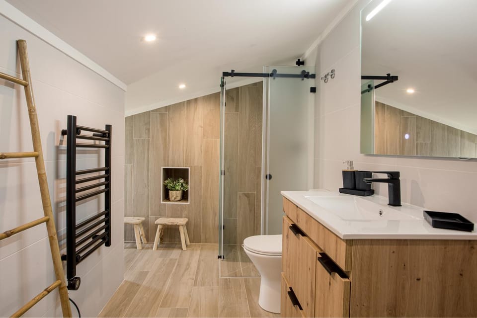 Shower, Toilet, Bathroom, hair dryier, towels, air conditioner