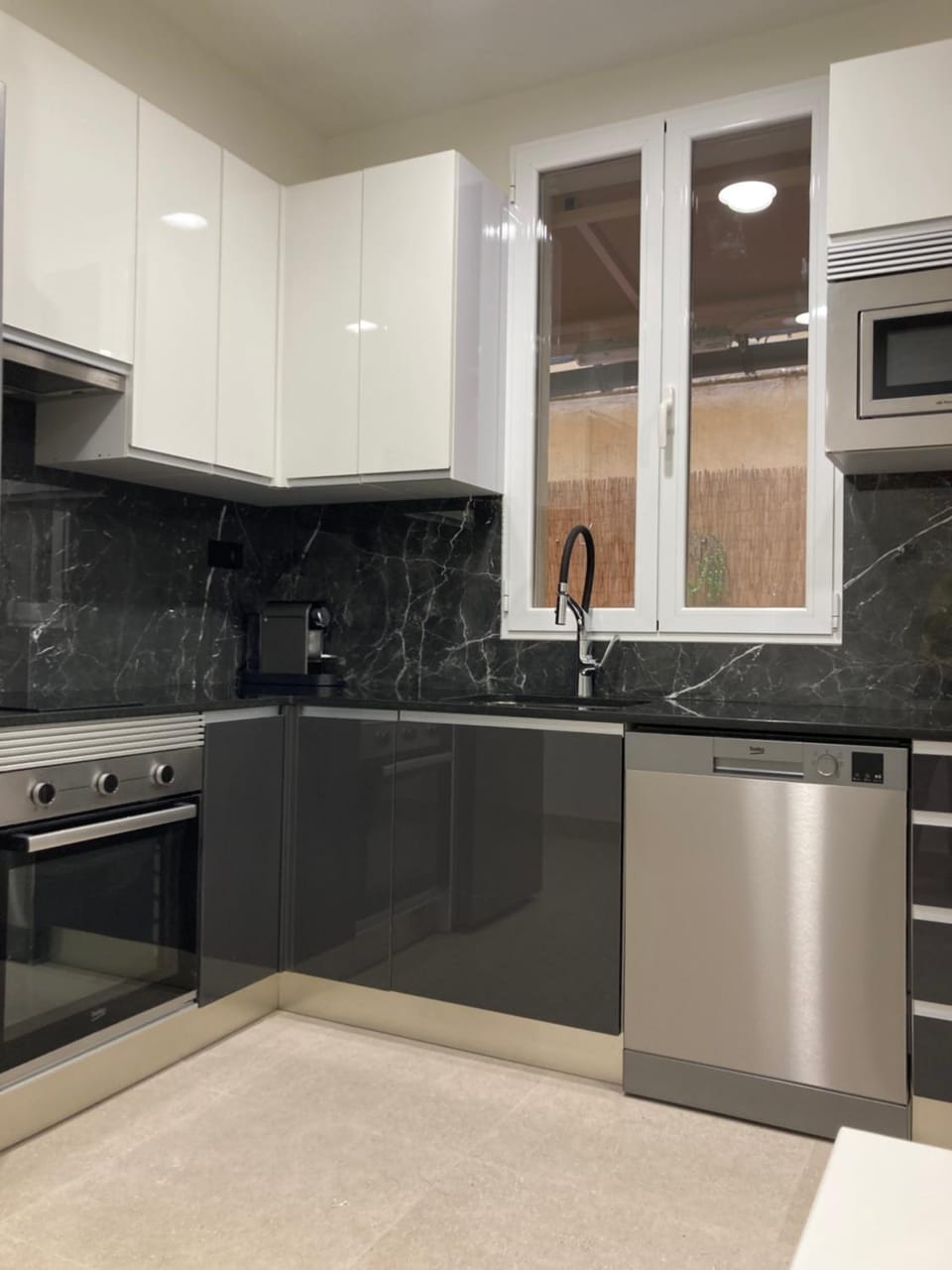 Kitchen or kitchenette, dishwasher, oven, stove