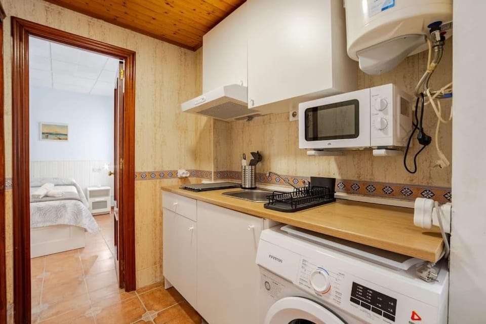 Kitchen or kitchenette, washing machine