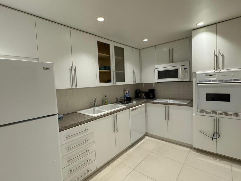 Kitchen or kitchenette, dishwasher, oven, stove, toaster