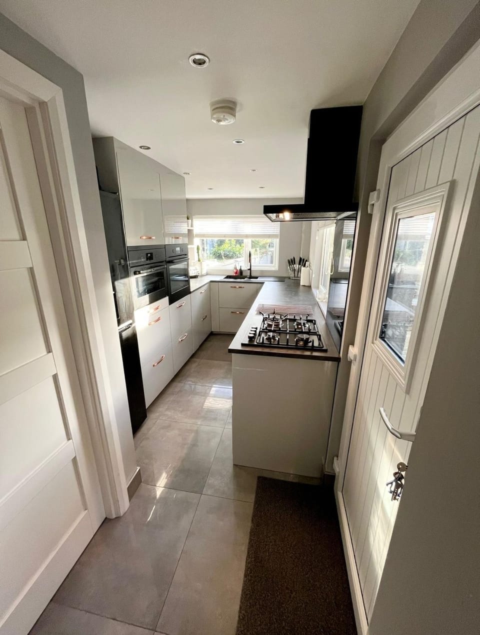 Kitchen or kitchenette, dishwasher, oven, stove