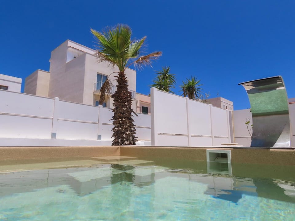 Property building, Day, Pool view, Swimming pool, sunbed