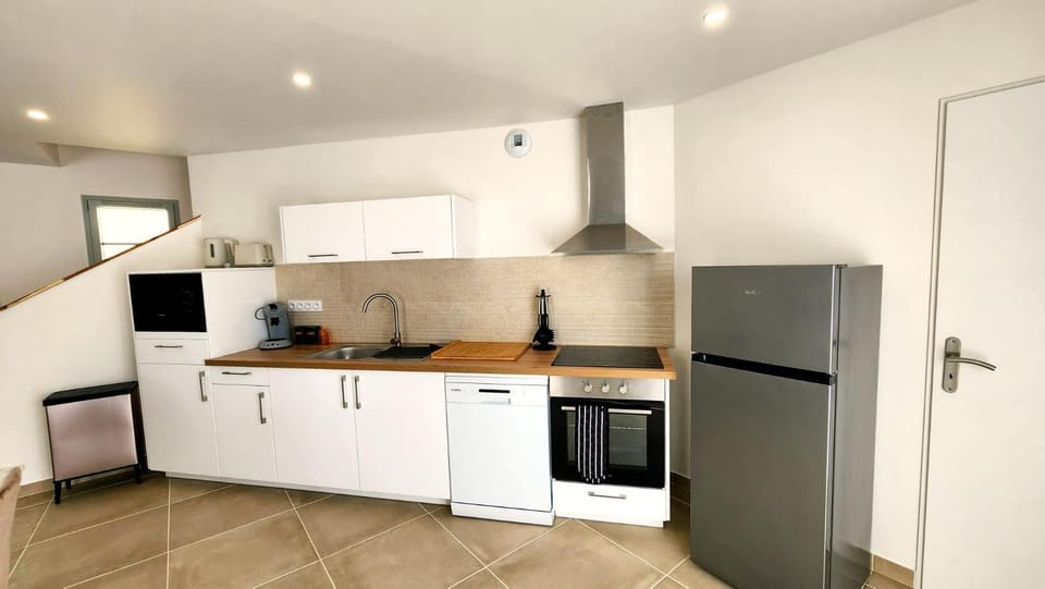 Kitchen or kitchenette, dishwasher, microwave, oven, stove