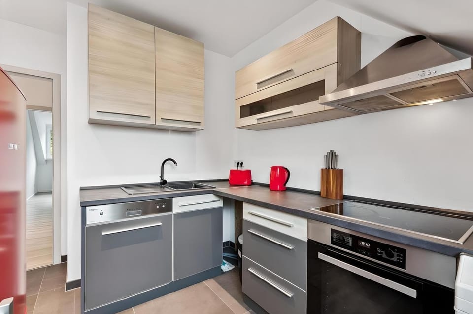 Kitchen or kitchenette, dishwasher, oven, stove, toaster