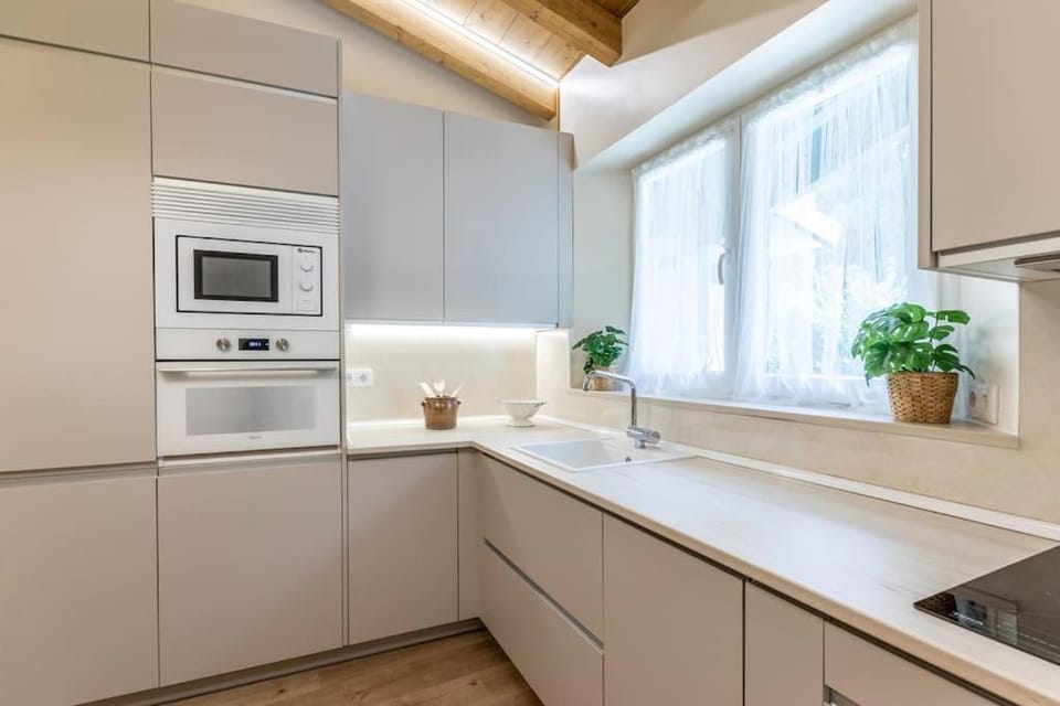 Kitchen or kitchenette, dishwasher, oven, stove, toaster