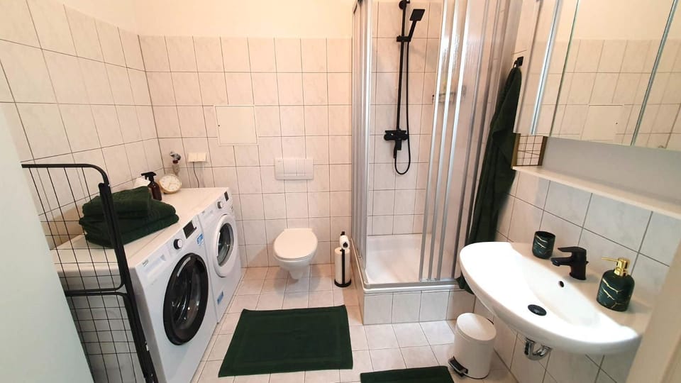 Shower, Toilet, Bathroom, towels, washing machine, dryer