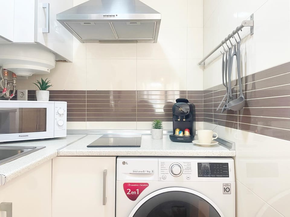 Kitchen or kitchenette, stove, toaster, washing machine, dryer