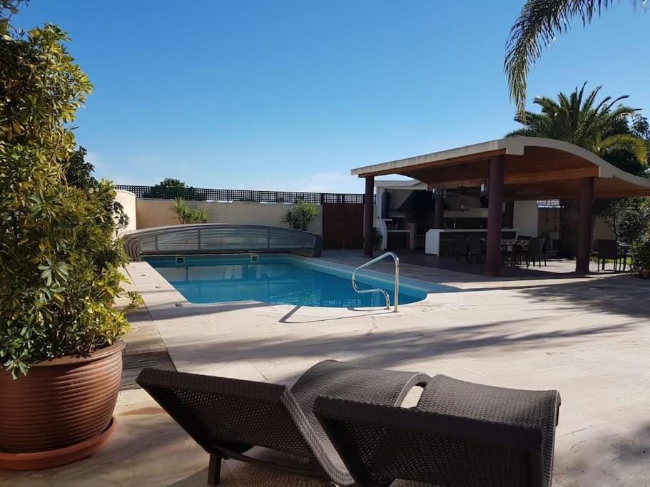 Patio, Day, Pool view, Swimming pool, sunbed