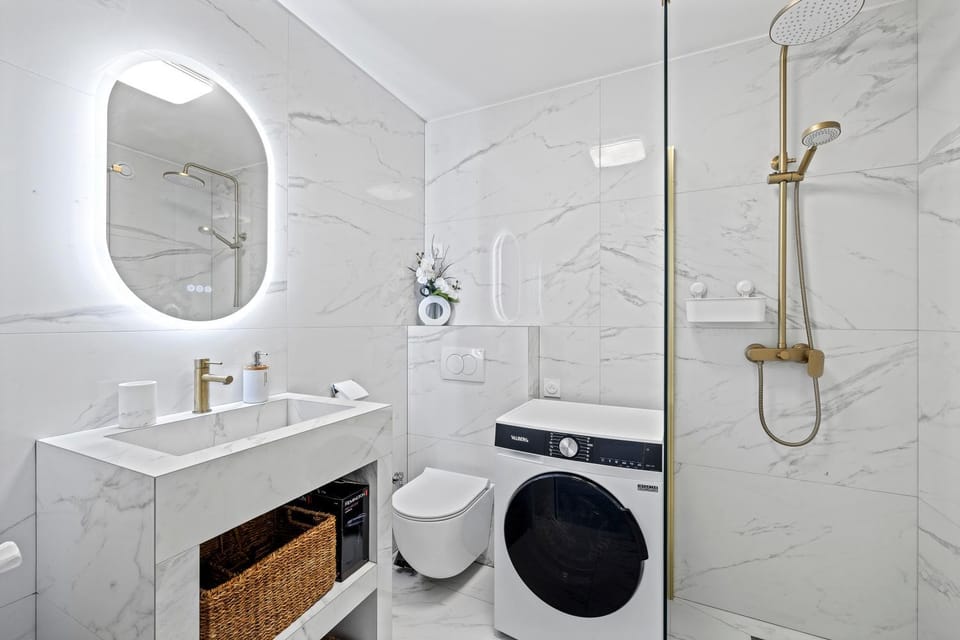 Shower, Toilet, Bathroom, towels, washing machine, dryer