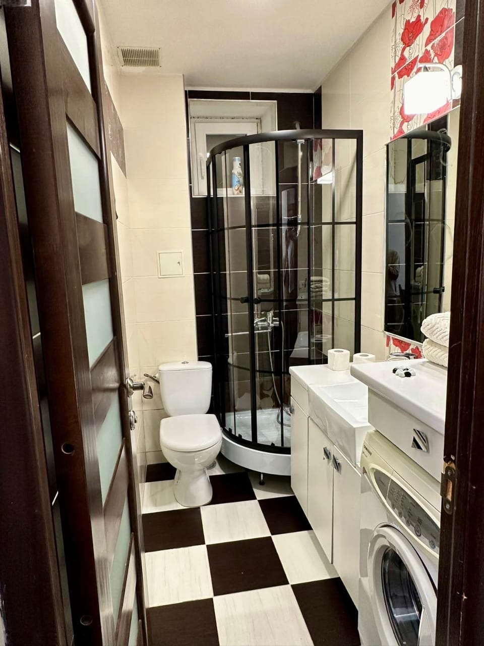 Shower, Toilet, Bathroom, hair dryier, towels, washing machine