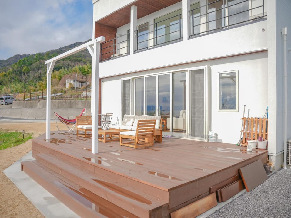 Property building, Patio, Day, Natural landscape, View (from property/room), Balcony/Terrace, Mountain view, Sea view, sunbed