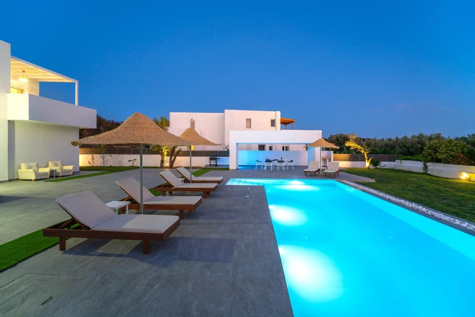 Property building, Patio, Night, Pool view, Swimming pool, sunbed