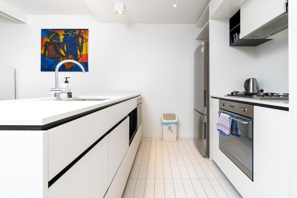 Kitchen or kitchenette, dishwasher, oven, stove