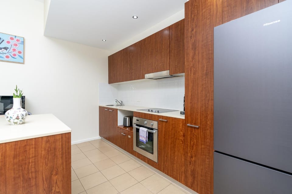 Kitchen or kitchenette, dishwasher, oven, stove