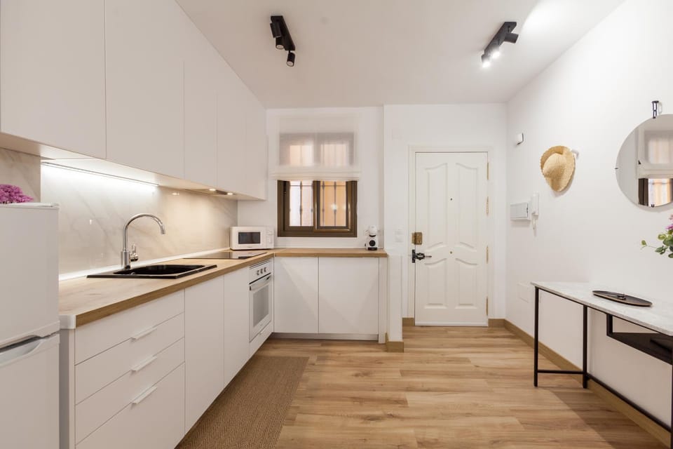 Kitchen or kitchenette, dishwasher, oven, stove, washing machine