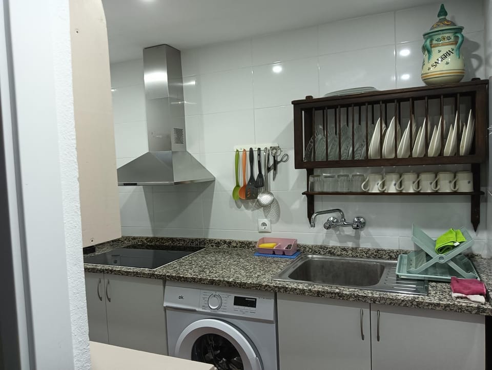 Kitchen or kitchenette, stove, washing machine