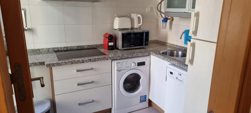 Kitchen or kitchenette, dishwasher, minibar, oven, stove, toaster, washing machine, dryer