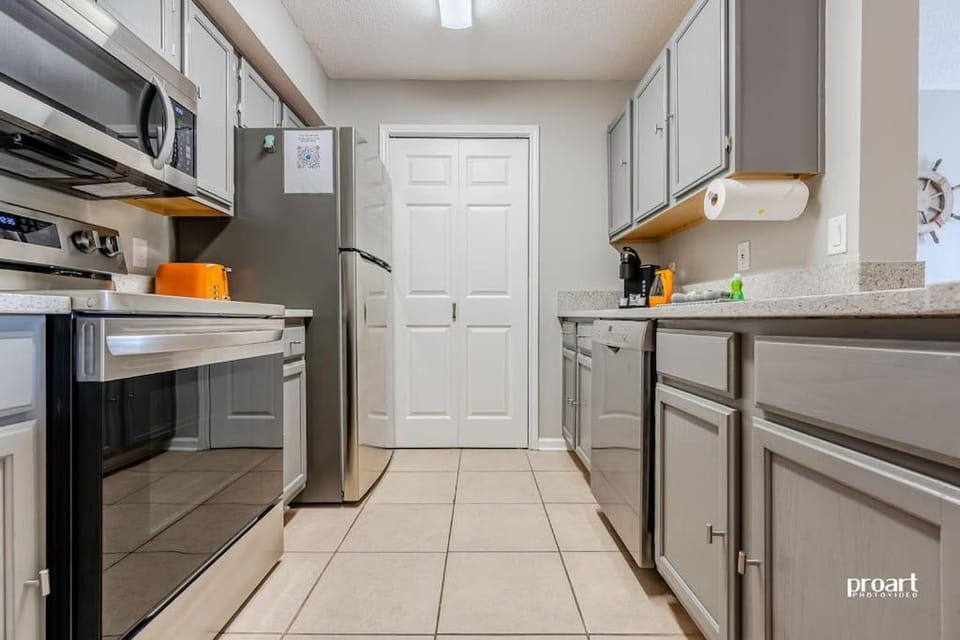 Kitchen or kitchenette, dishwasher, oven, stove, toaster