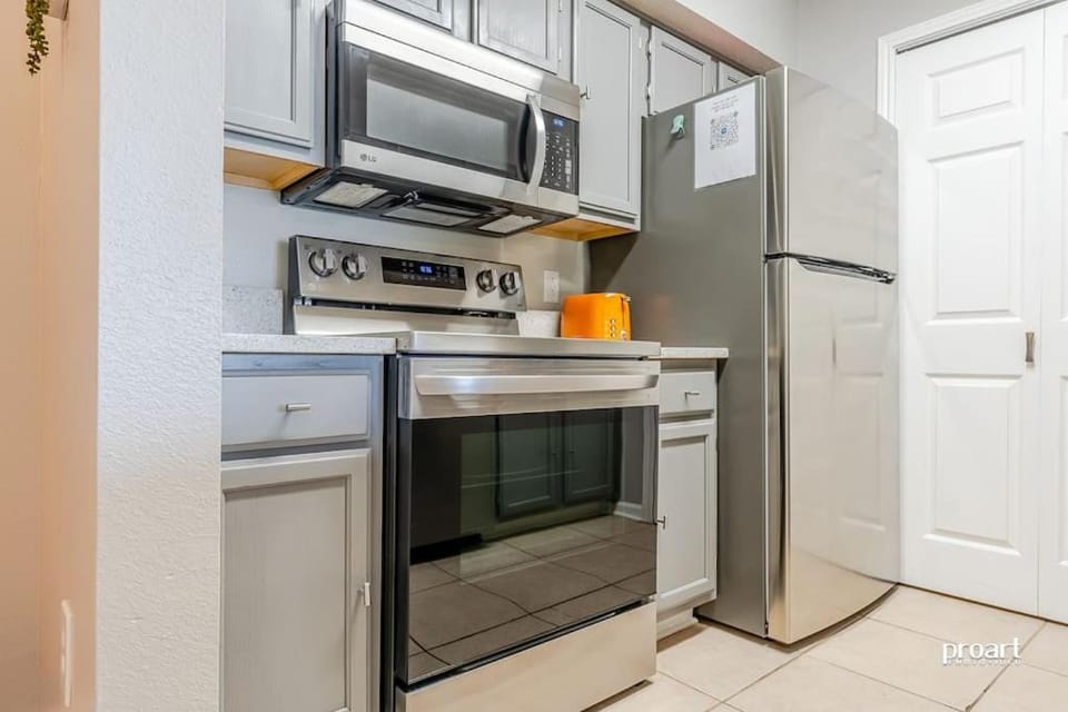 Kitchen or kitchenette, dishwasher, oven, stove, toaster