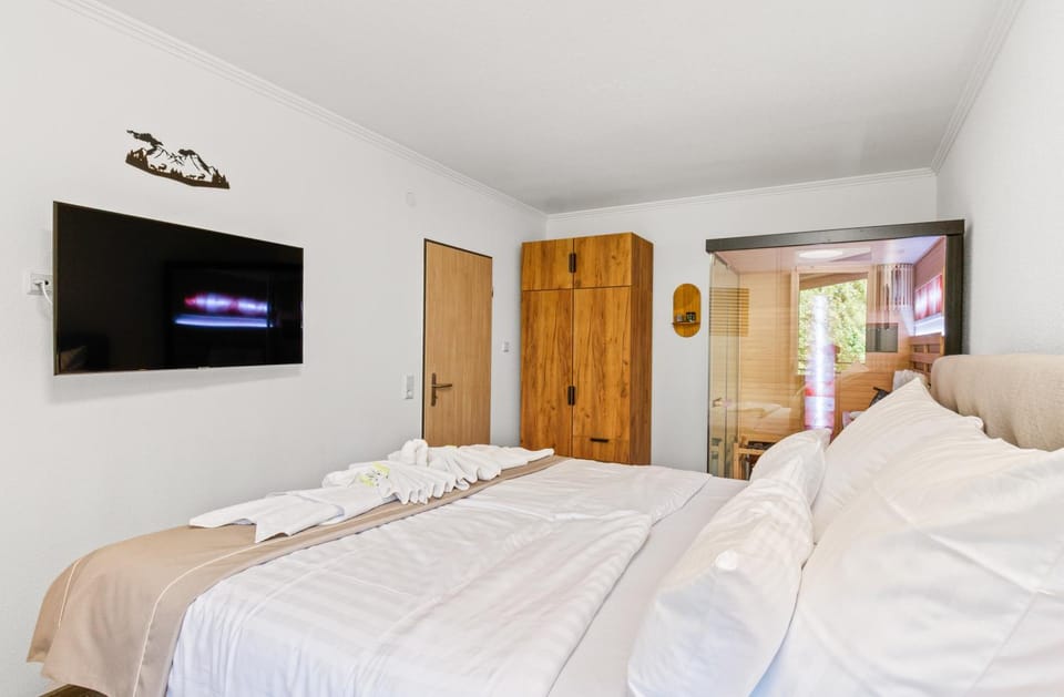 Bed, TV and multimedia, Bedroom, towels, wardrobe