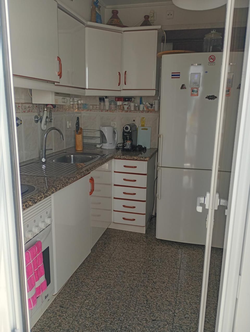 Kitchen or kitchenette, dishwasher, oven, stove
