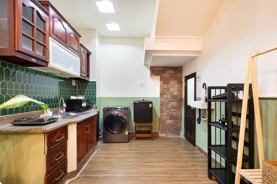 Kitchen or kitchenette, microwave, stove, washing machine