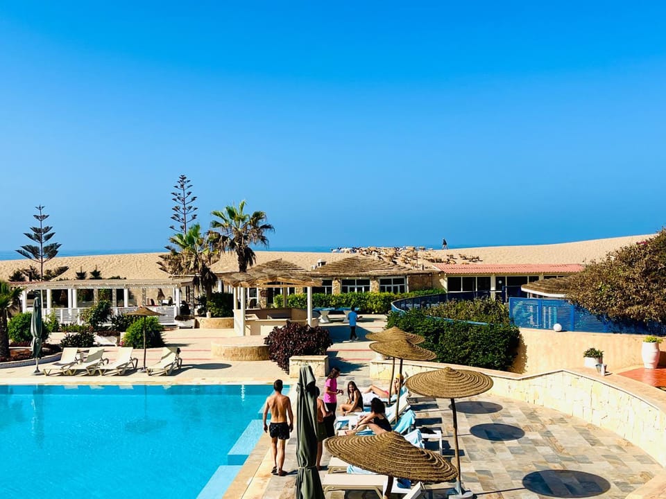 Property building, Patio, Day, Natural landscape, Pool view, Sea view, Swimming pool, sunbed