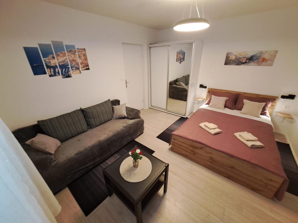 Bed, Living room, Seating area, Bedroom