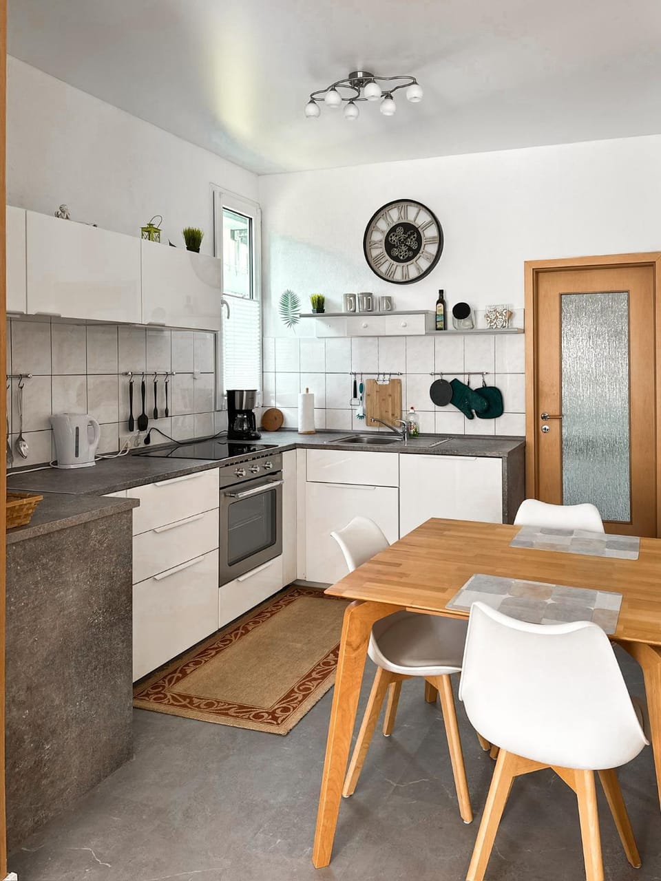 Kitchen or kitchenette, dishwasher, oven, stove