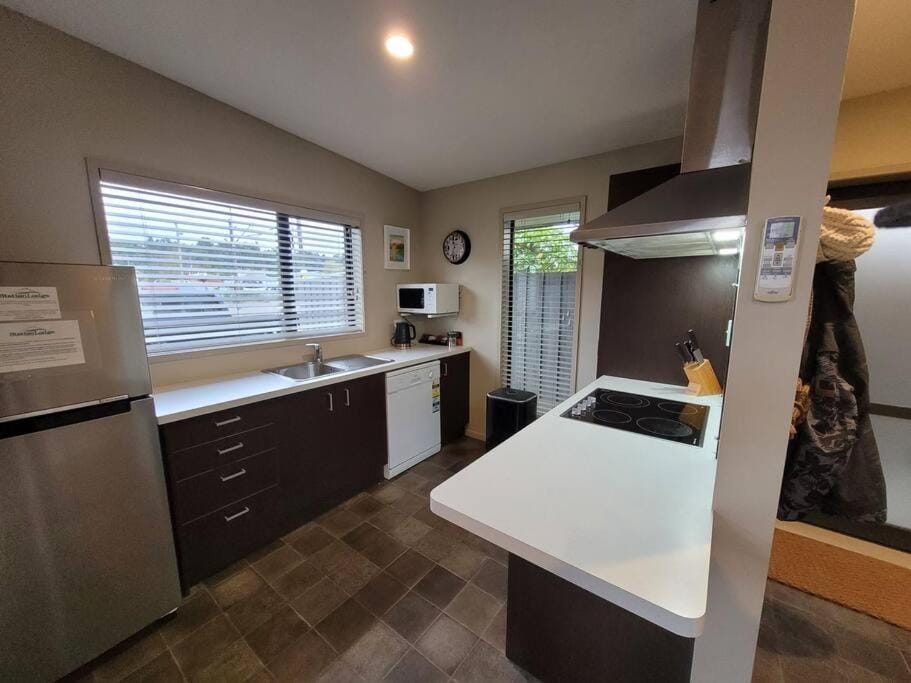 Kitchen or kitchenette, dishwasher, oven, stove