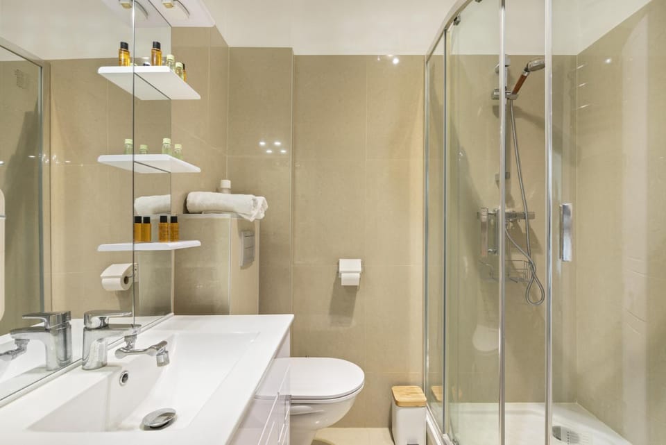 Shower, Toilet, Bathroom, hair dryier, towels