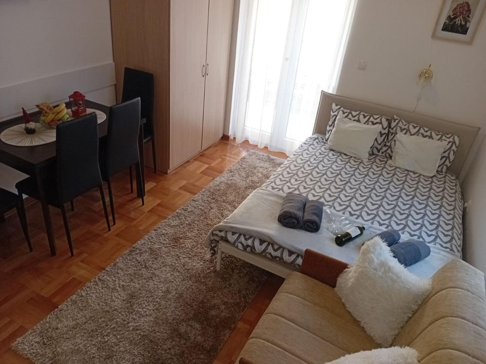 Bed, Seating area, Text overlay