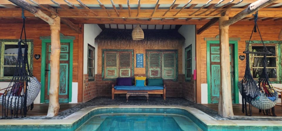 Living room, Seating area, Pool view