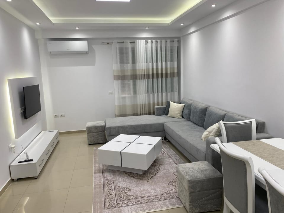 Bed, TV and multimedia, Living room, Seating area, air conditioner