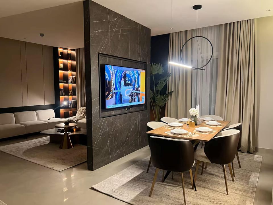 Property building, TV and multimedia, Living room, Seating area, Dining area