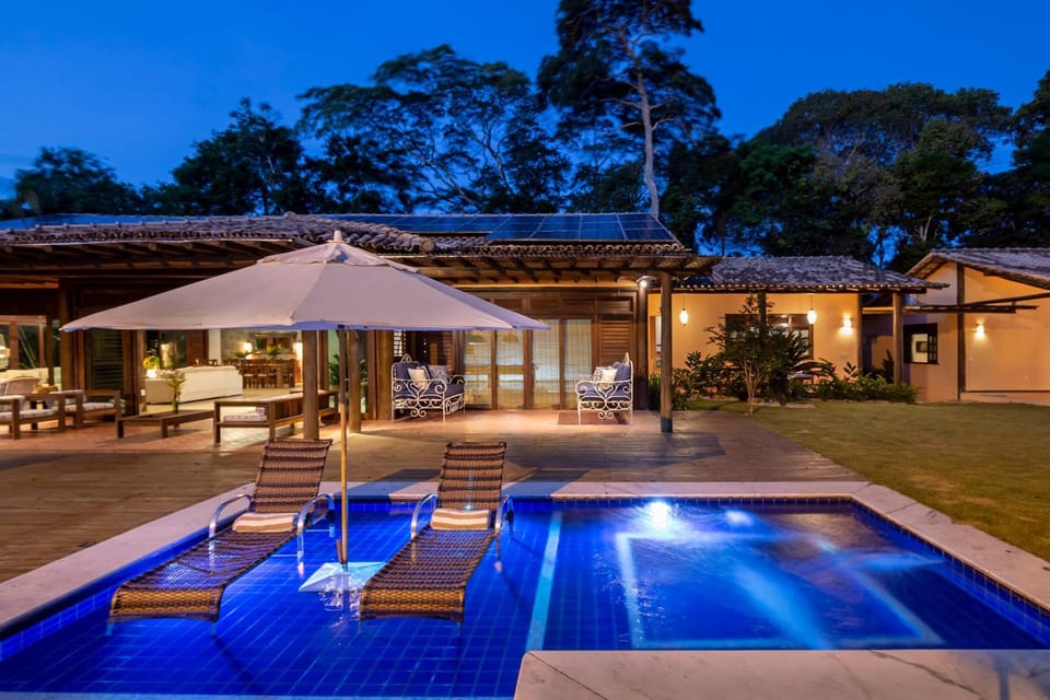 Property building, Patio, Night, Pool view, Swimming pool, sunbed
