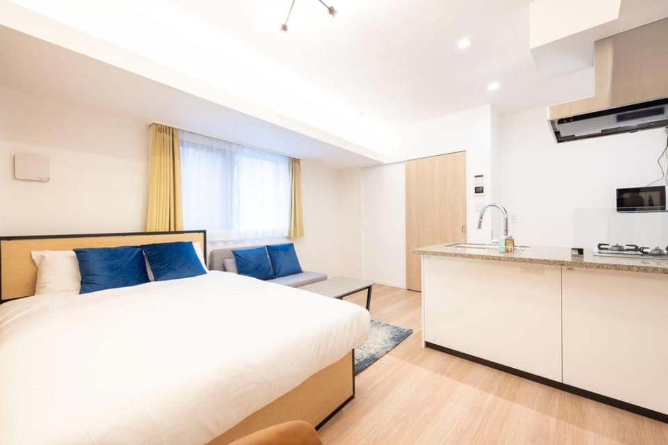Bed, Kitchen or kitchenette, Seating area