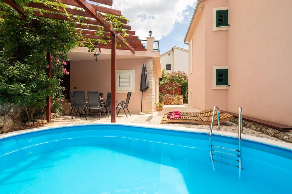 Property building, Patio, Seating area, Pool view, Swimming pool, sunbed