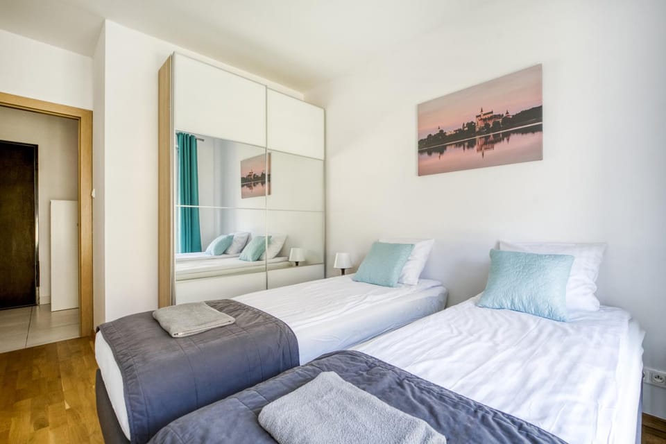 Bed, towels, wardrobe