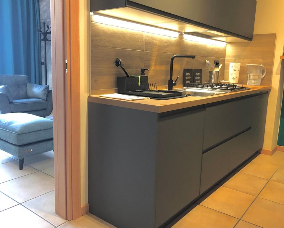 Kitchen or kitchenette, microwave, stove, toaster