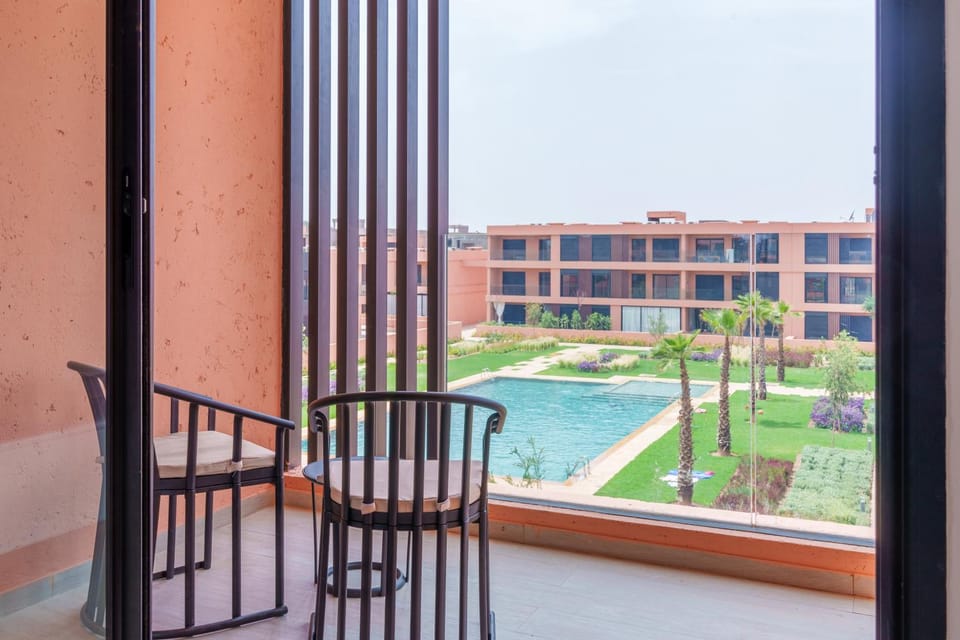 Property building, Patio, Spring, Day, Garden, View (from property/room), Balcony/Terrace, Garden view, Pool view, Swimming pool